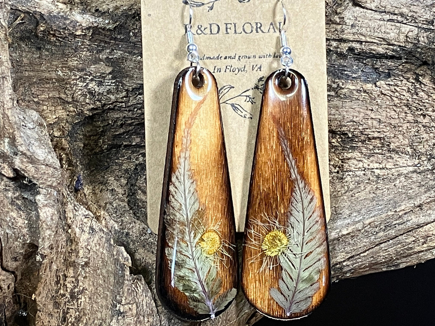 Floral jewelry featuring Japanese Fern Earrings preserved in resin