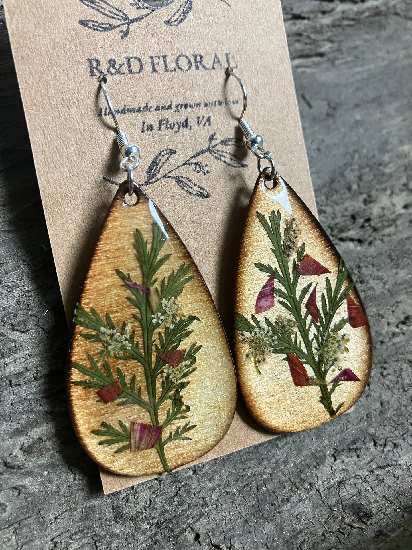Handmade earrings featuring preserved Queen Anne’s Lace and Wormwood in resin, hypoallergenic posts, delicate floral jewelry.