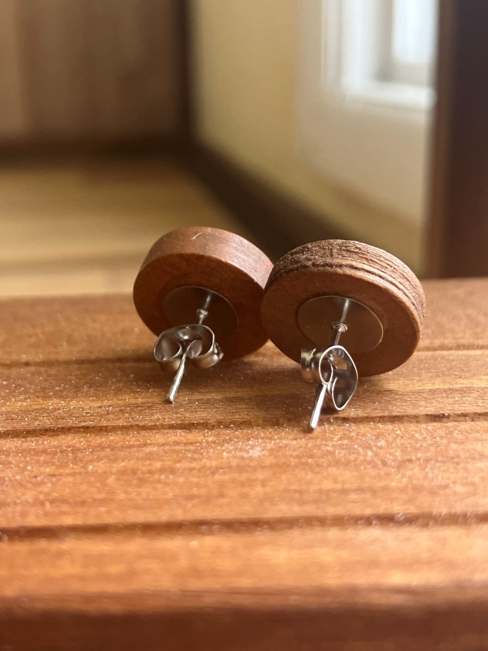 Hot pink wooden stud earrings encasing real Queen Anne’s Lace flowers handmade by R & D Floral.