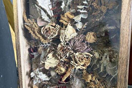 Older wedding bouquet preserved in a wooden shadow box by R&D Floral