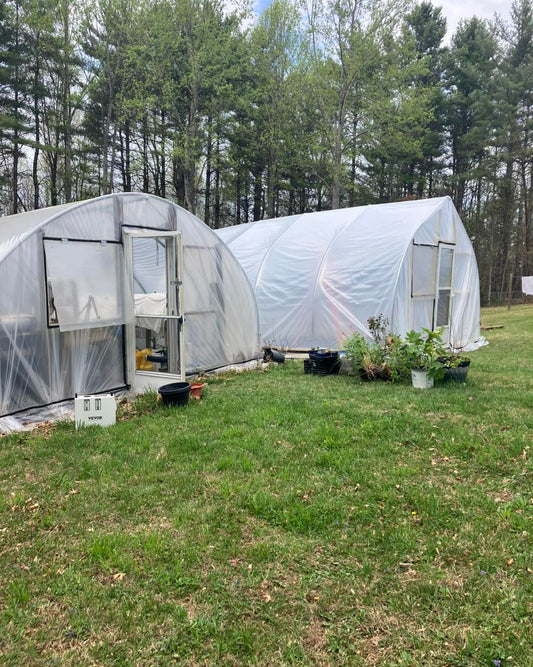 Two greenhouses at R & D Floral in Floyd, Virginia, used for growing and preserving real flowers for handmade jewelry and botanical products