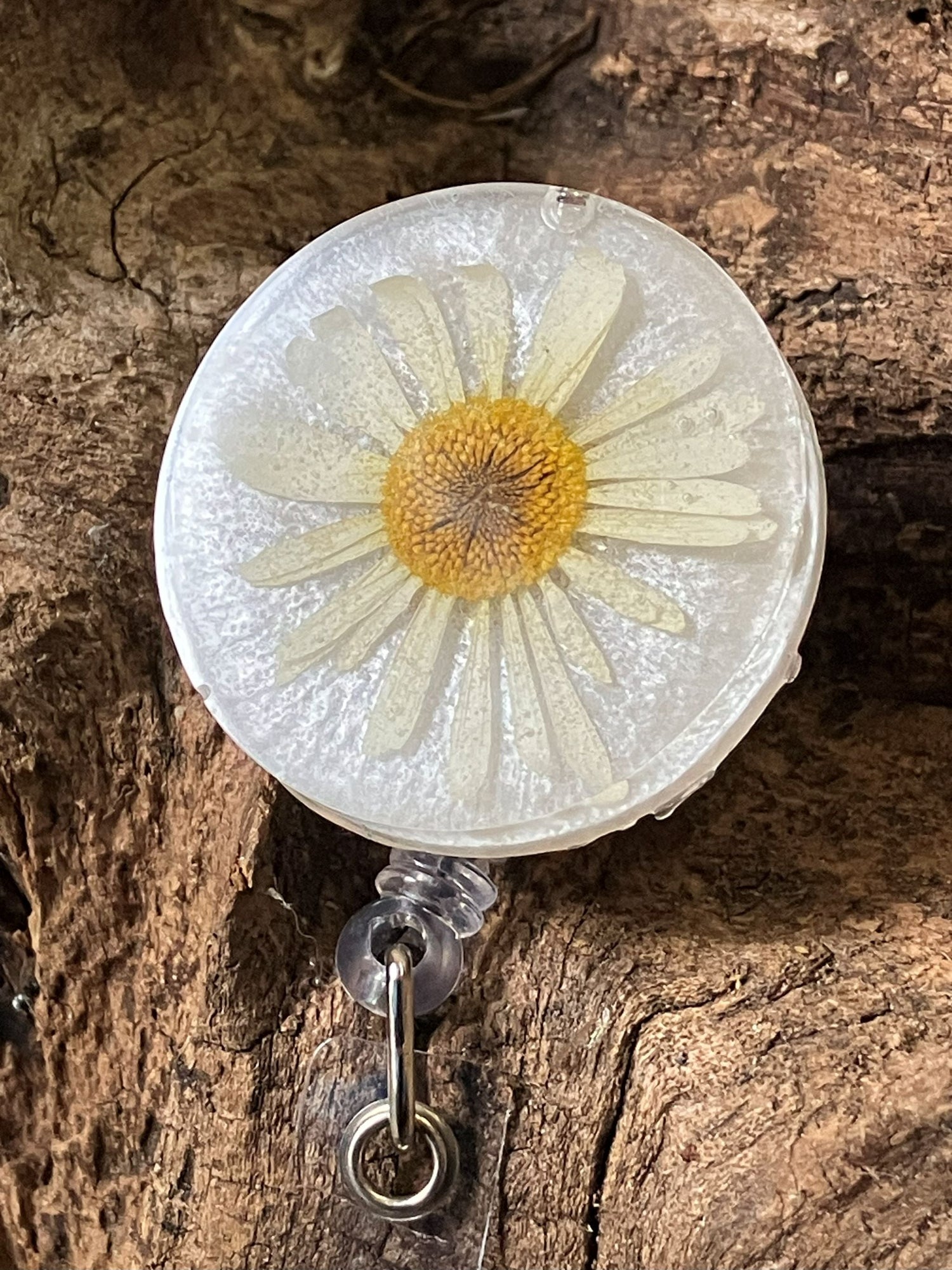 Real flower resin badge reel by R & D Floral — 1.5-inch durable, lightweight floral ID holder handcrafted in Floyd, VA.