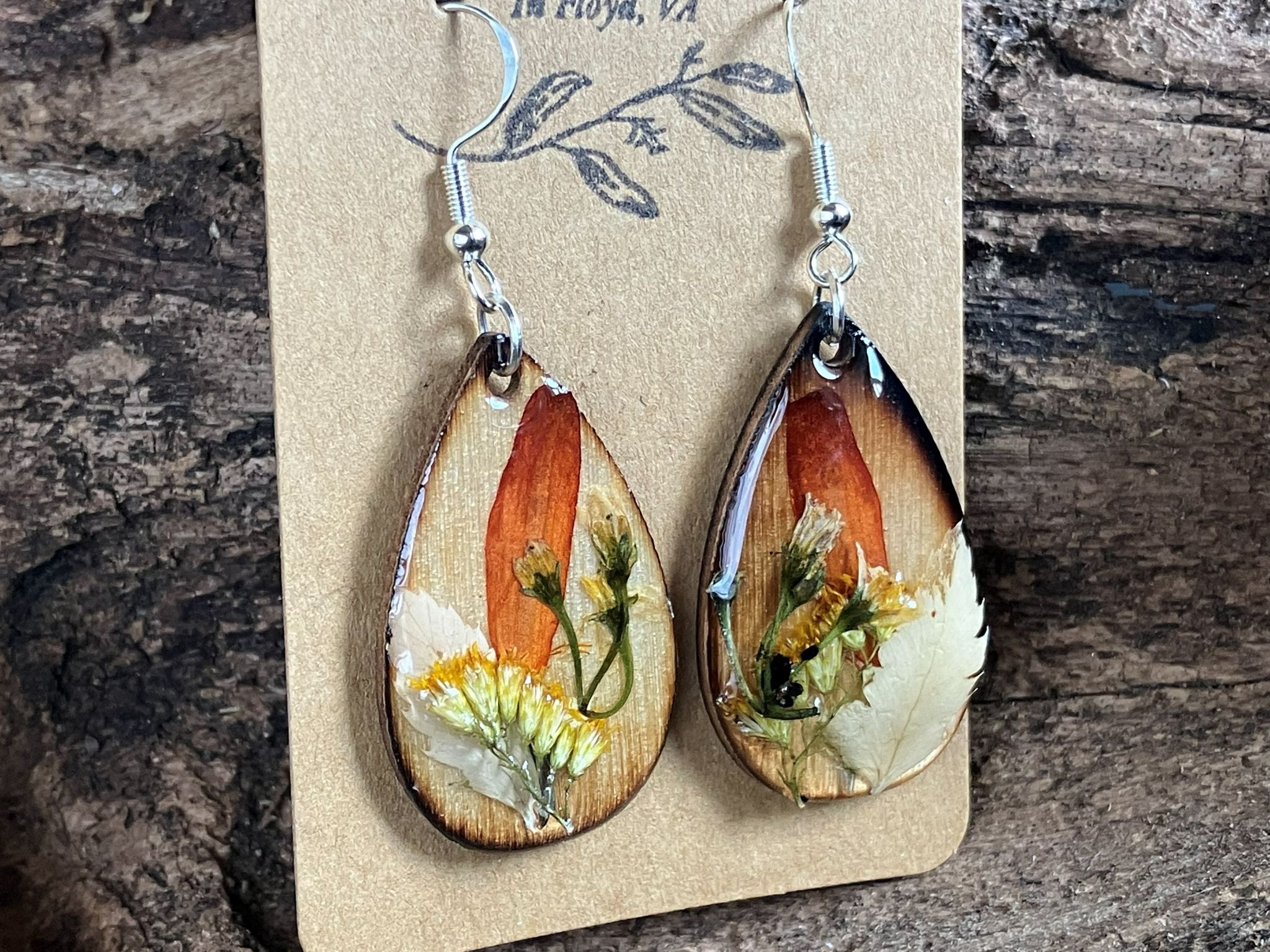 Artisan wooden earrings handmade with real fern, zinnia, thistle, and solidago flowers encased in resin by R & D Floral.