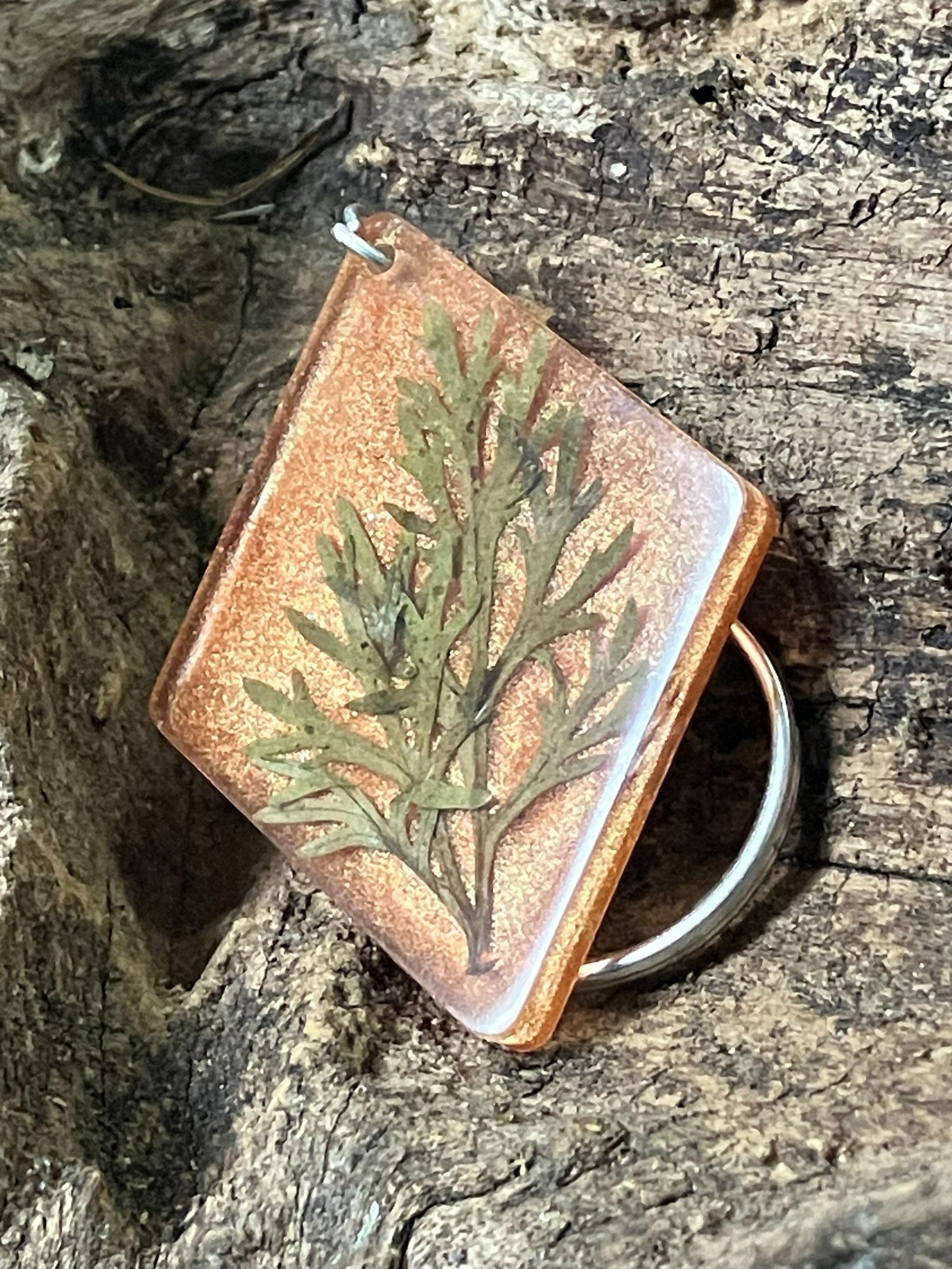 Copper resin keychain with real artemisia leaves encased inside, handcrafted by R & D Floral.