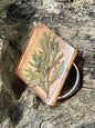 Copper resin keychain with real artemisia leaves encased inside, handcrafted by R & D Floral.