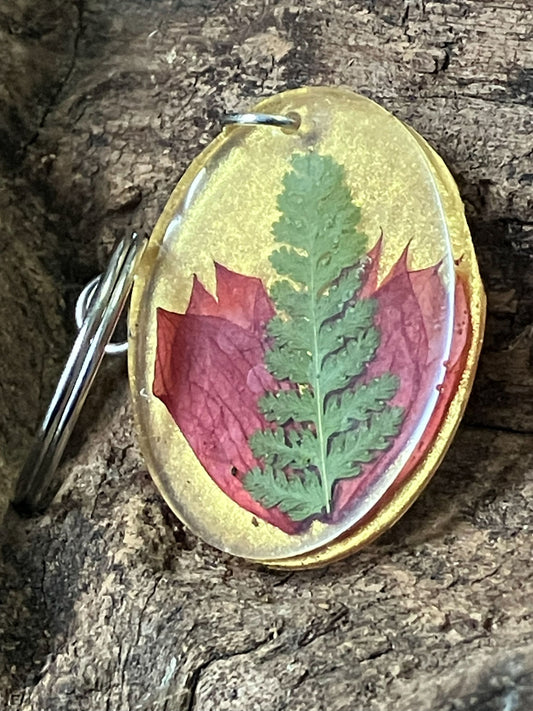 Gold resin keychain with real fern and salvia flowers preserved inside, handcrafted by R & D Floral.