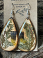 Handcrafted wooden earrings with real moonflower petals in smoky, earthy tones encased in resin by R & D Floral.