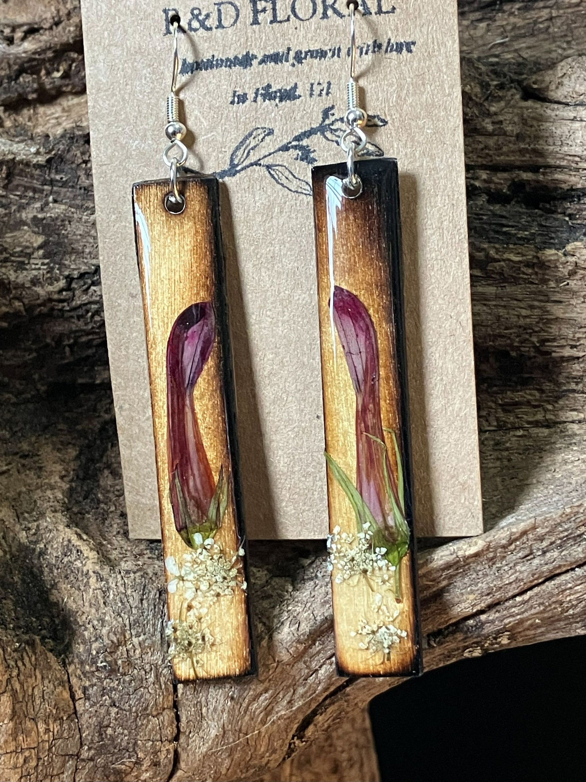 Handmade wooden rectangle earrings with real cardinal flower and Queen Anne’s lace preserved in resin by R & D Floral.