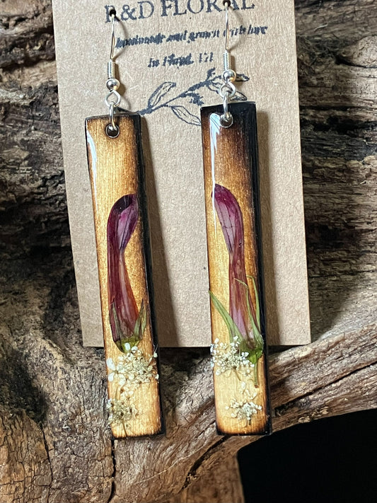 Handmade wooden rectangle earrings with real cardinal flower and Queen Anne’s lace preserved in resin by R & D Floral.