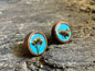 Hand-painted light blue wooden stud earrings with real pressed spirea flowers encased in resin by R & D Floral.