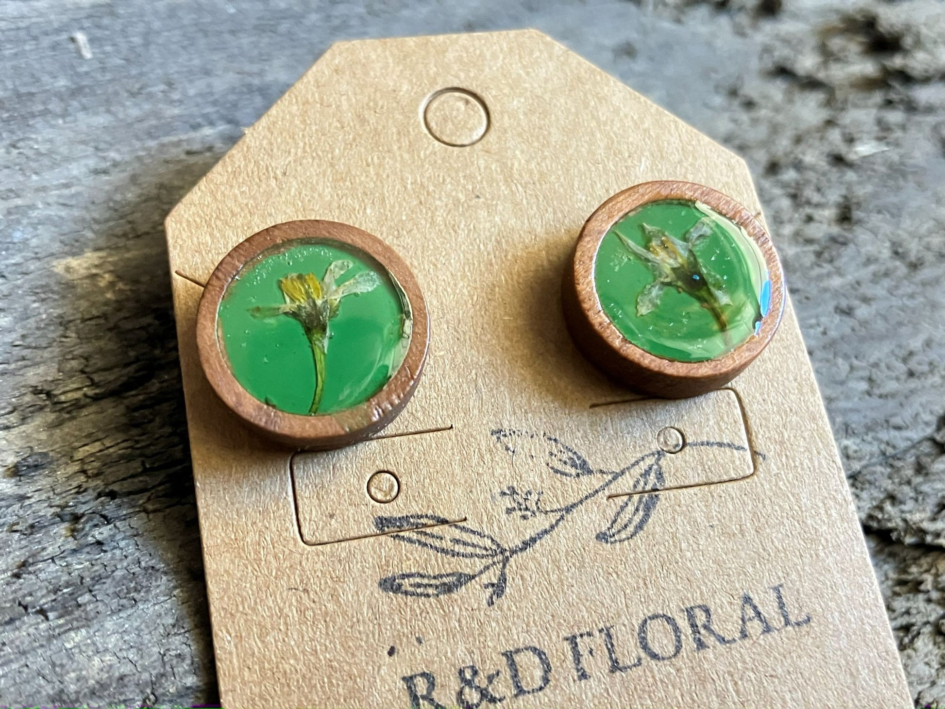 Hand-painted green wooden stud earrings with real thistle flowers preserved in resin by R & D Floral.