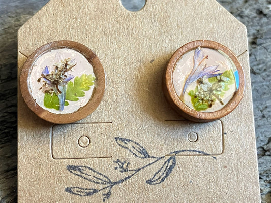 Hand-painted peach wooden stud earrings with multiple pressed flowers encased in resin, handcrafted by R & D Floral.