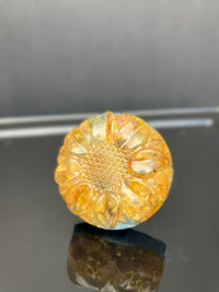 Sunny yellow clover drawer knob preserved in clear resin with a light blue background.