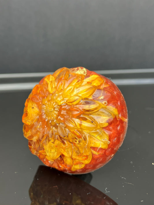 Drawer knob featuring real sunflower petals preserved in clear resin with warm golden tones.
