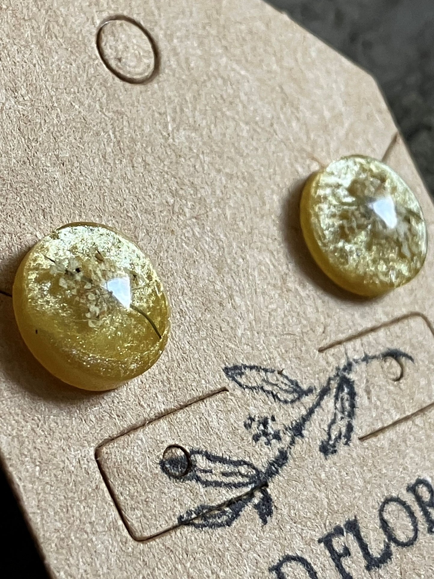 Yellow resin stud earrings encasing real Queen Anne’s Lace flowers handmade by R&D Floral.