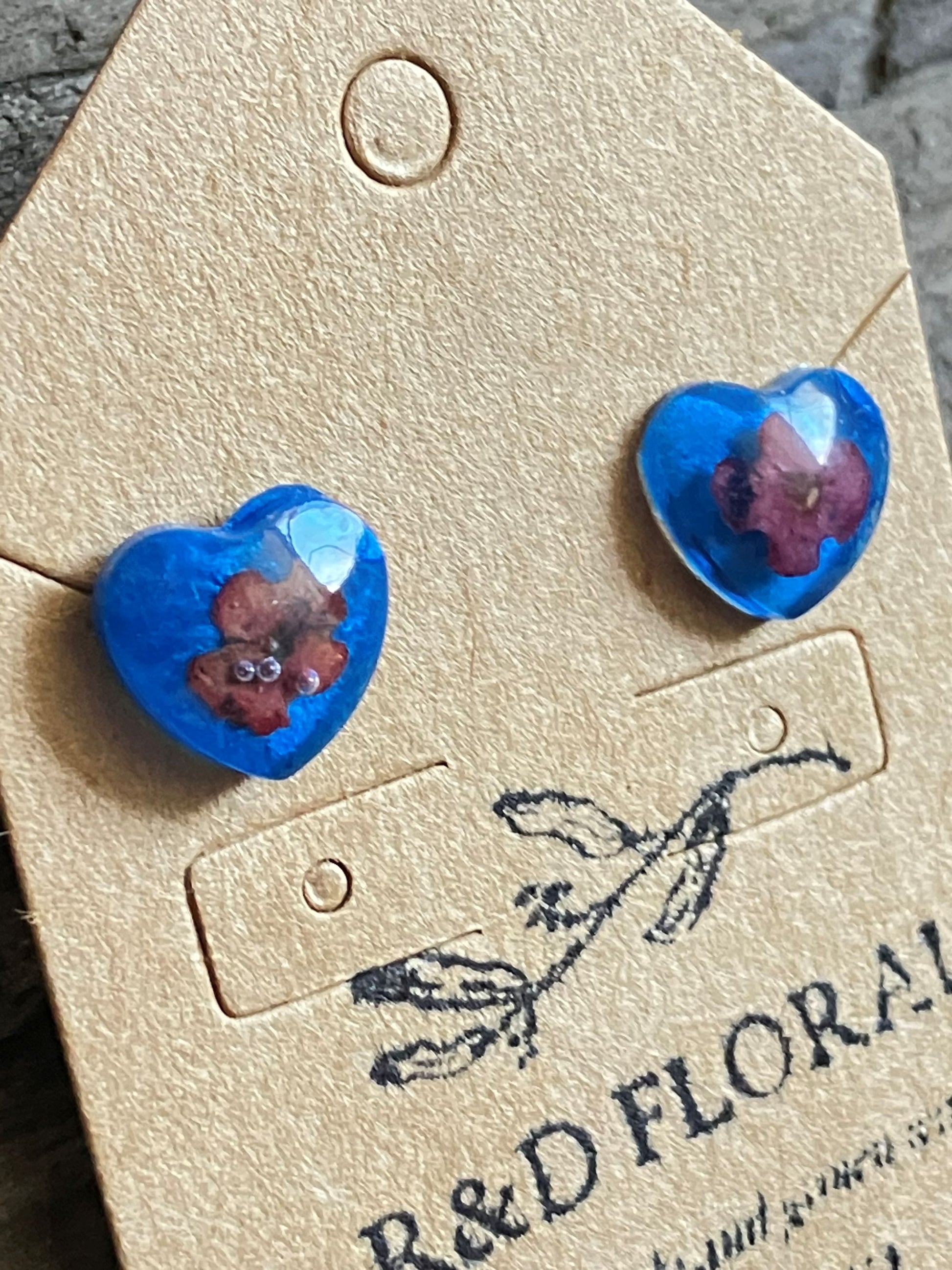 Cobalt blue resin stud earrings encasing real Lantana flowers handmade by R&D Floral.