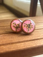 Hot pink wooden stud earrings encasing real Queen Anne’s Lace flowers handmade by R & D Floral.