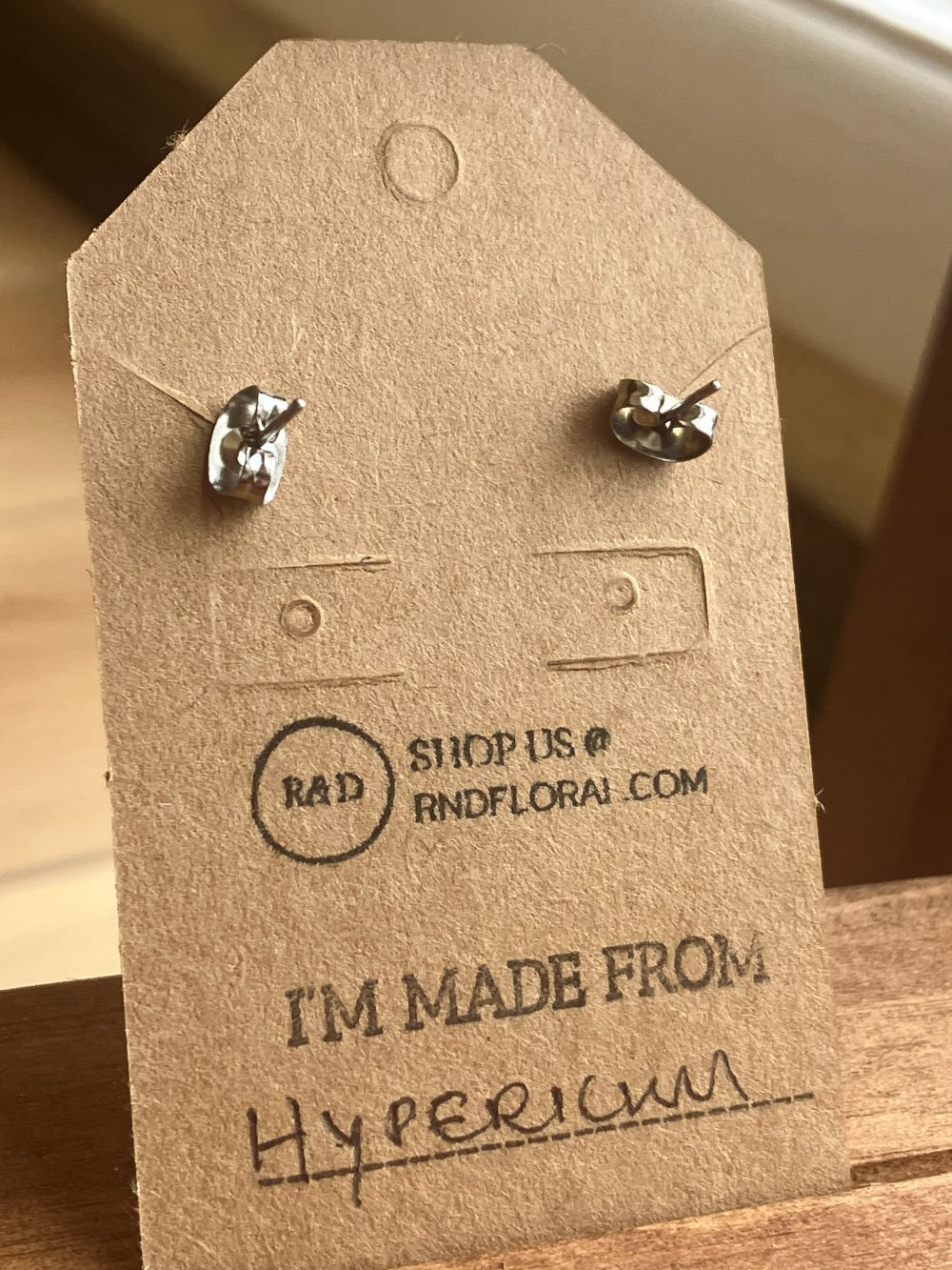 Wooden stud earrings encasing a small real Hypericum flower handmade by R & D Floral.
