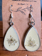 Light Yellow Metal Queen Anne's Lace Earrings on product card, silver teardrop bezel with pressed flowers in cream yellow resin