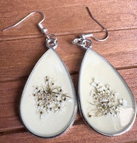 Close-up of Light Yellow Metal Queen Anne's Lace Earrings showing delicate pressed flower detail