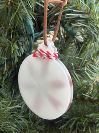 Back of the red Salvia and Queen Anne's Lace snowflake white resin ornament showing the smooth reverse side