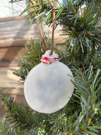 Back of the Salvia and Artemisia white resin ornament showing the smooth reverse side