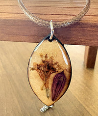 Salvia and Elderberry wooden pendant necklace close up