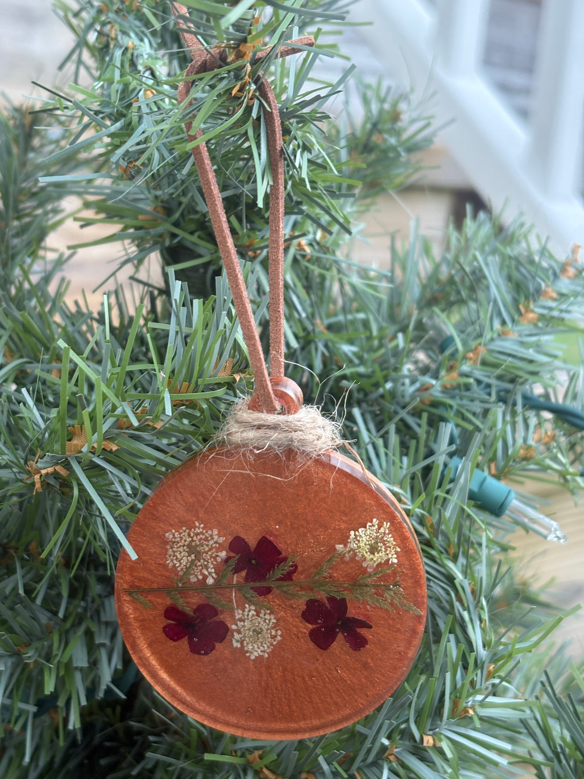 Verbena and Queen Anne's Lace pressed flower ornament in copper resin on leather cord